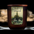 Image depicts a frosted amber candle jar with lid and a label depicting an oil painting of stormy seas and a lighthouse.