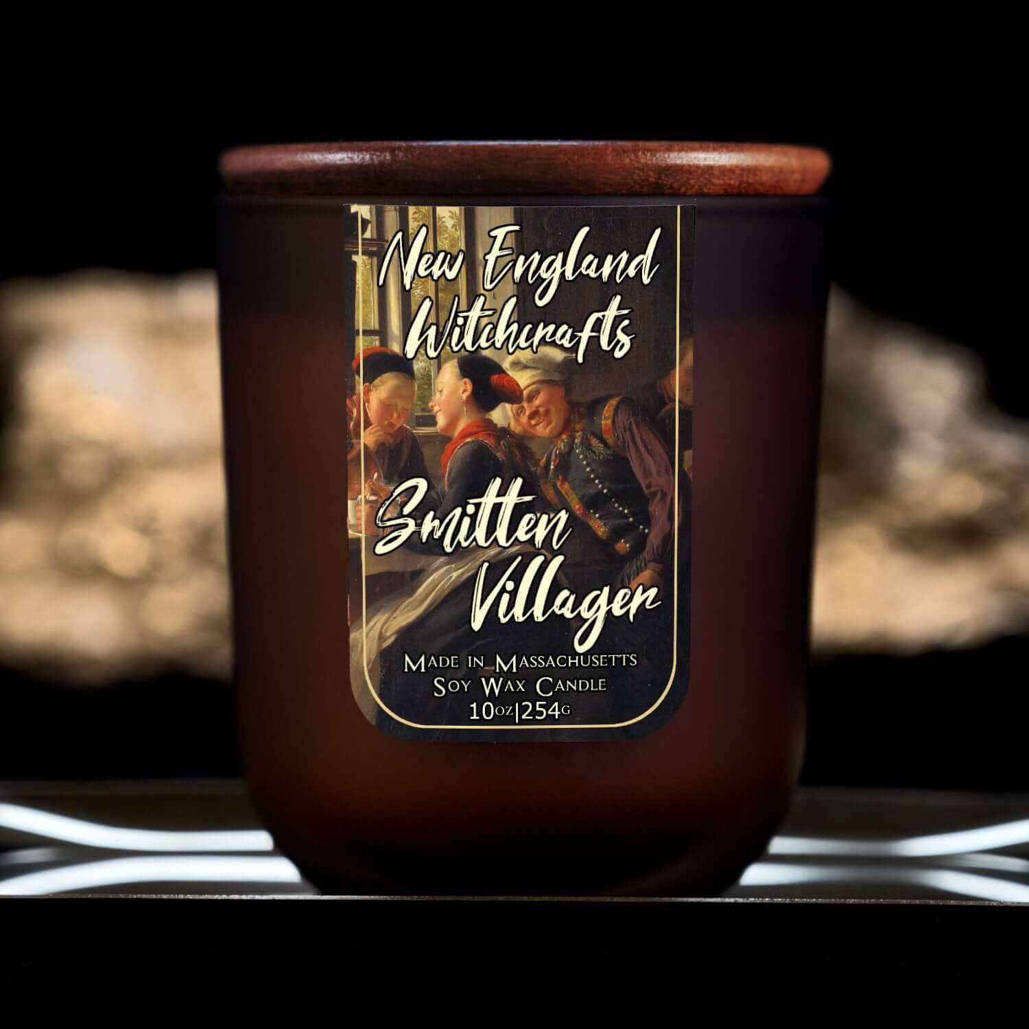 Image depicts a frosted amber candle jar with lid and a label depicting an oil painting of a lovestruck man.