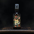 Image depicts a room spray bottle with floral print label.