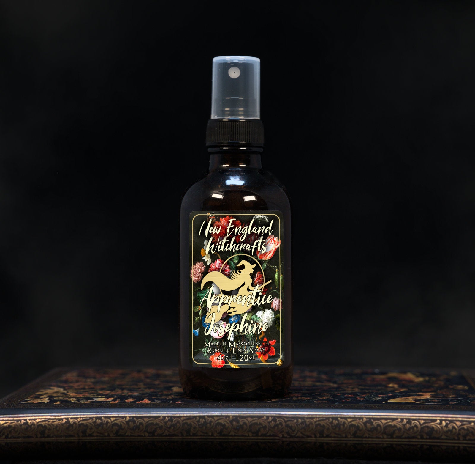 Image depicts a room spray bottle with floral print label.