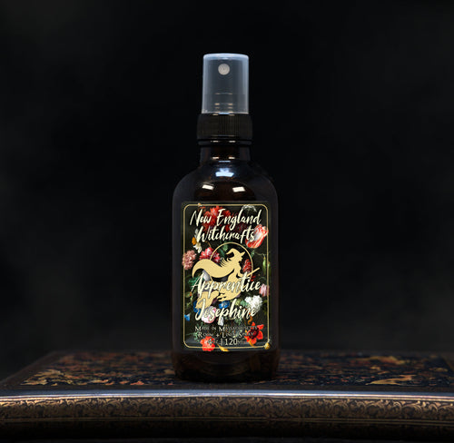 Image depicts a room spray bottle with floral print label.