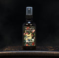 Image depicts a room spray bottle with floral print label.