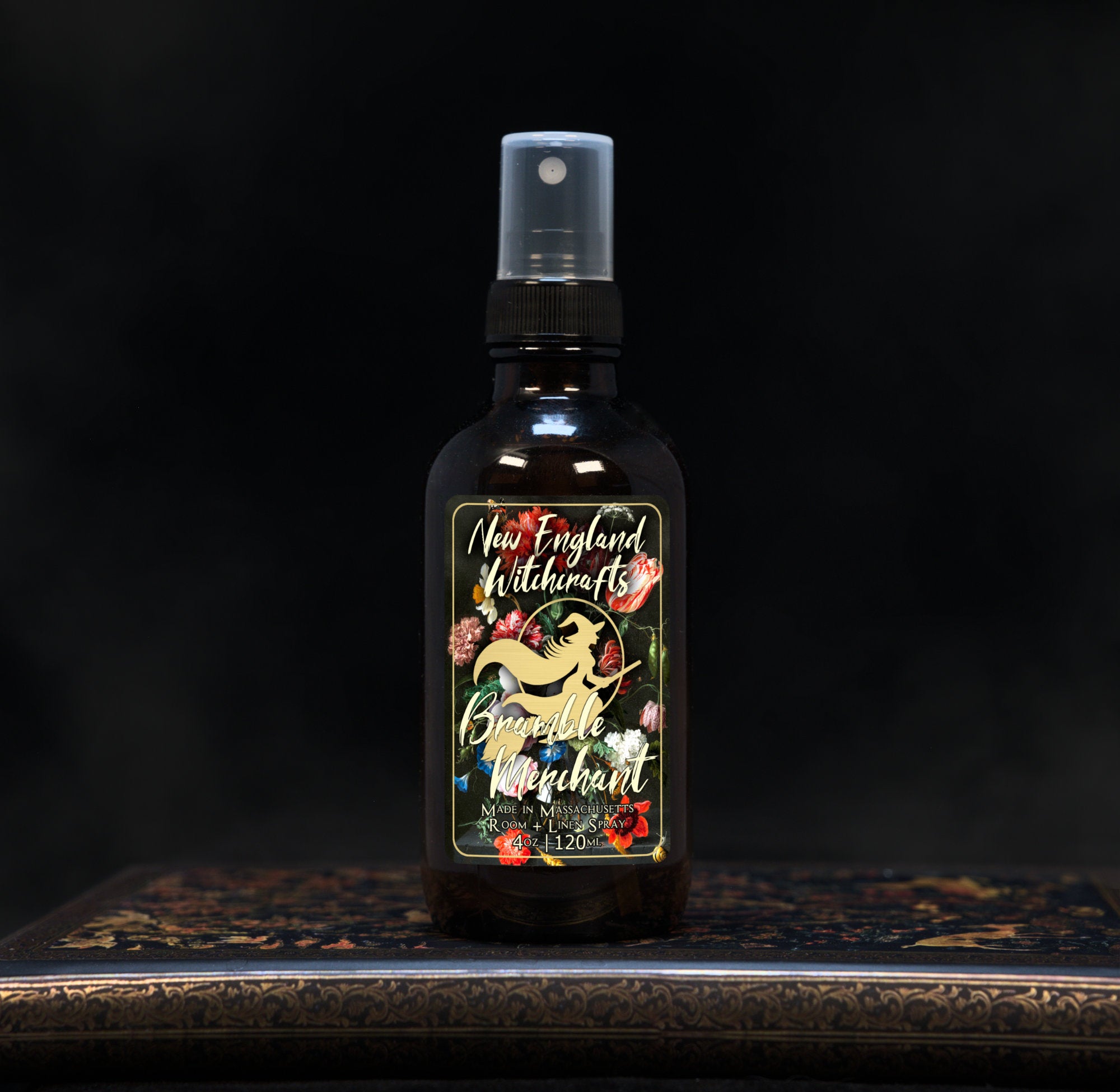 Image depicts a room spray bottle with floral print label.