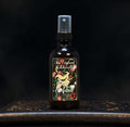 Image depicts a room spray bottle with floral print label.