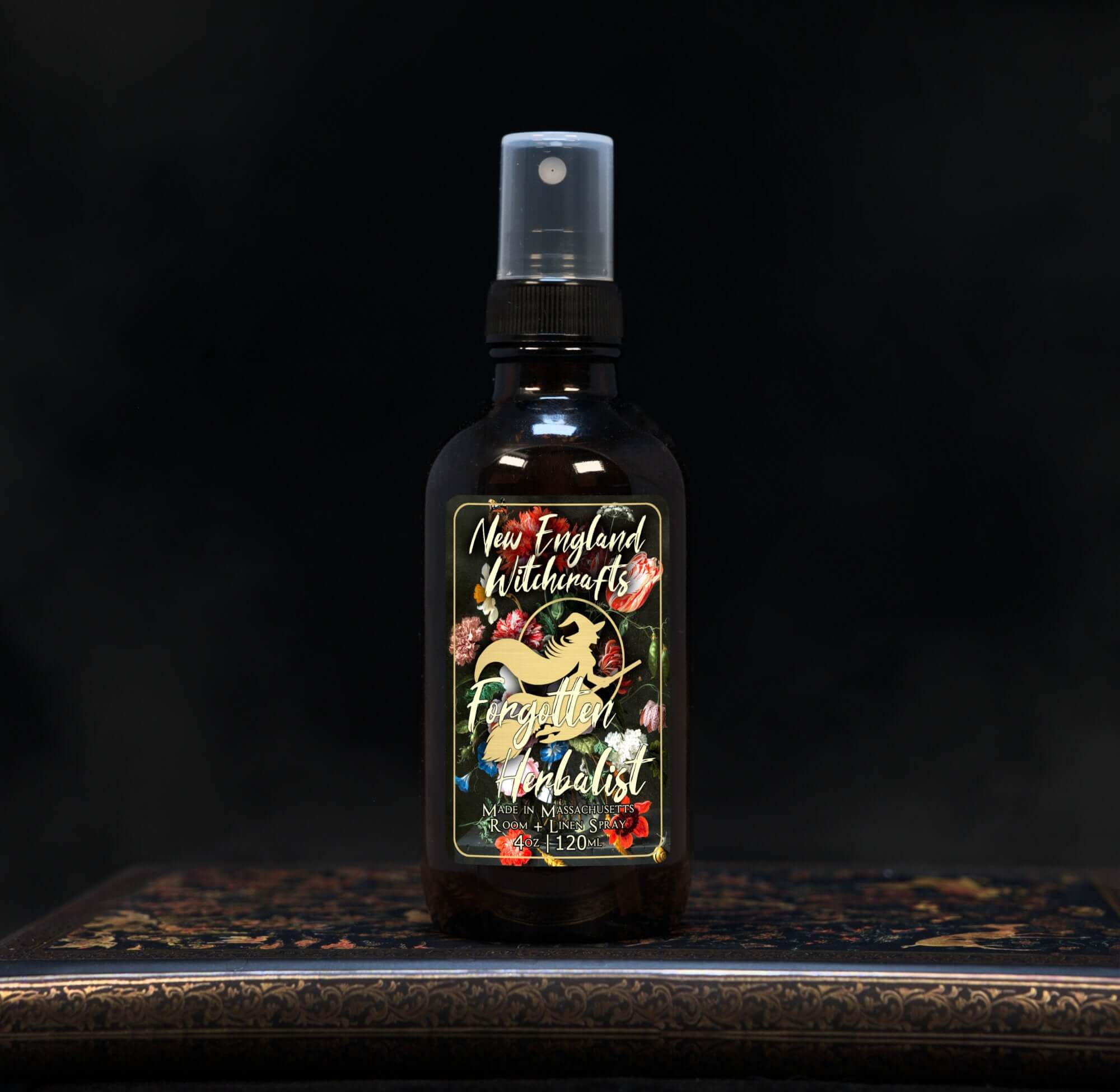 Image depicts a room spray bottle with floral print label.